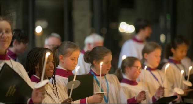 choir children singing in cathedral with candles